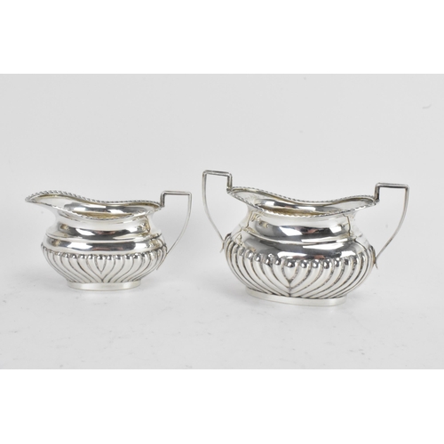 43 - An early 20th century silver 'Bachelors' three piece tea set, by Jones & Crompton, the teapot hallma... 