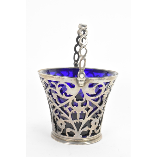 45 - A late 19th/early 20th century silver small basket, marks rubbed, having a blue glass liner, rope tw... 