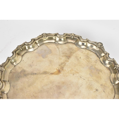 47 - A George V silver salver by Adie Brothers, hallmarked Birmingham 1931, having a Chippendale rim with... 