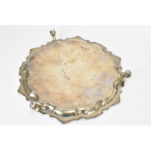 47 - A George V silver salver by Adie Brothers, hallmarked Birmingham 1931, having a Chippendale rim with... 