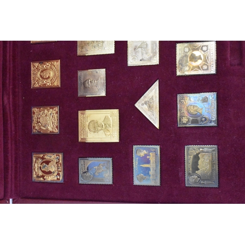 51 - The Empire Collection, silver gilt replica stamps comprising twenty five replica stamps in a fitted ... 