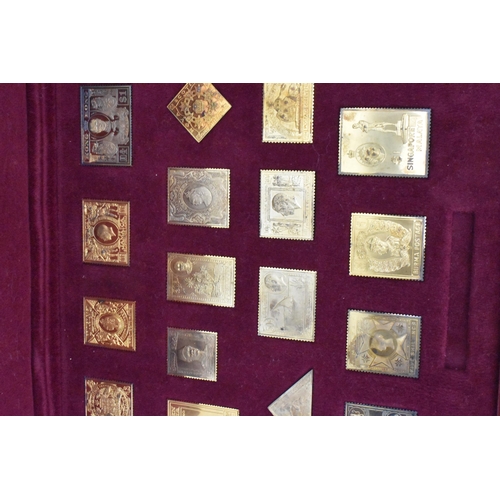 51 - The Empire Collection, silver gilt replica stamps comprising twenty five replica stamps in a fitted ... 