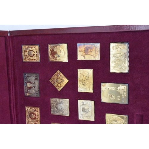 51 - The Empire Collection, silver gilt replica stamps comprising twenty five replica stamps in a fitted ... 