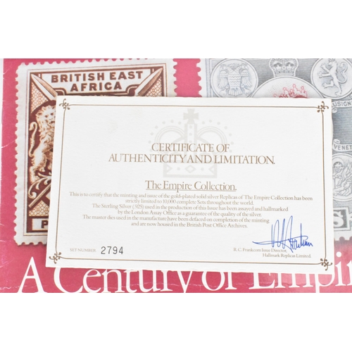 51 - The Empire Collection, silver gilt replica stamps comprising twenty five replica stamps in a fitted ... 