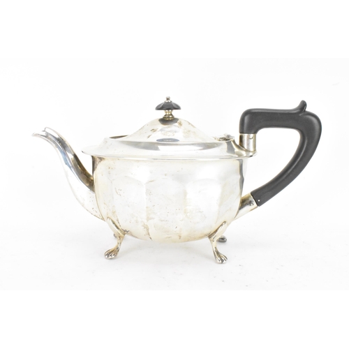 52 - A George VI silver teapot by Viner's Ltd (Emile Viner) hallmarked Sheffield 1938, having an ebonised... 