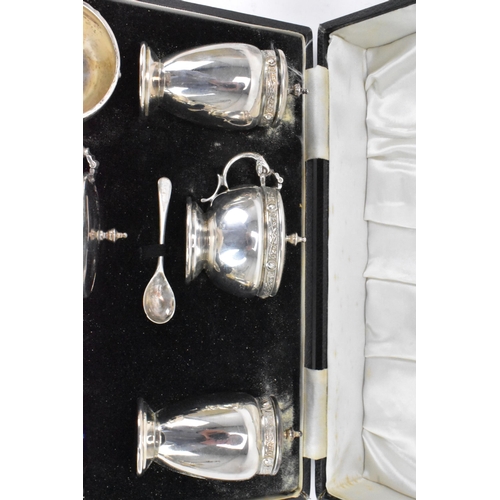 59 - A George VI silver cased cruet set by Charles S Green & Co Ltd, hallmarked Birmingham 1948, consisti... 