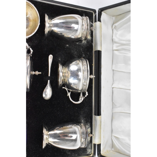 59 - A George VI silver cased cruet set by Charles S Green & Co Ltd, hallmarked Birmingham 1948, consisti... 