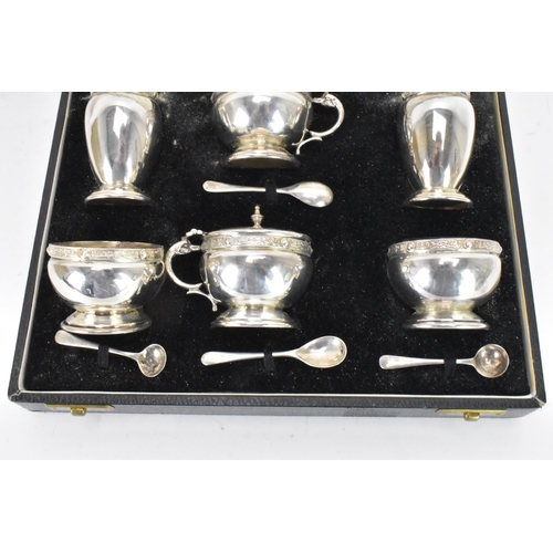 59 - A George VI silver cased cruet set by Charles S Green & Co Ltd, hallmarked Birmingham 1948, consisti... 