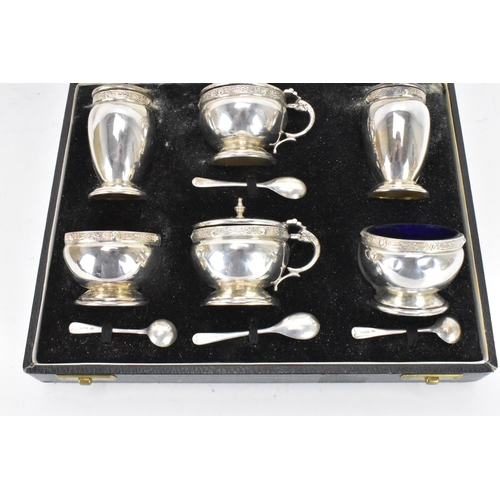 59 - A George VI silver cased cruet set by Charles S Green & Co Ltd, hallmarked Birmingham 1948, consisti... 