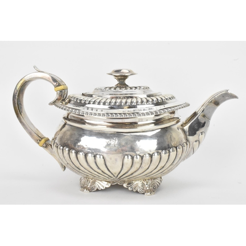 6 - A George III silver teapot, by Alice & George Burrows II, hallmarked London 1814, having a reeded bo... 