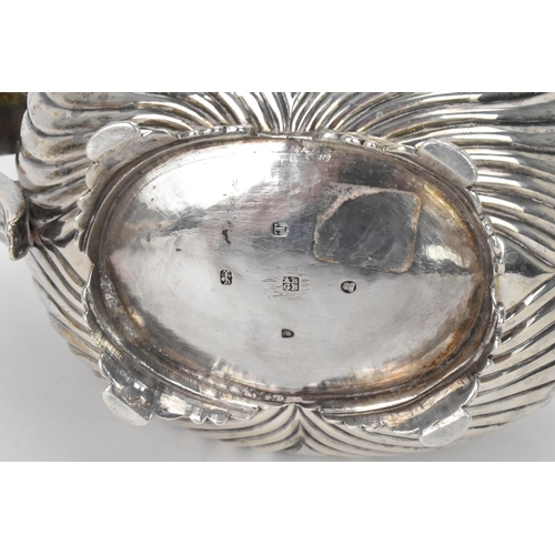 6 - A George III silver teapot, by Alice & George Burrows II, hallmarked London 1814, having a reeded bo... 