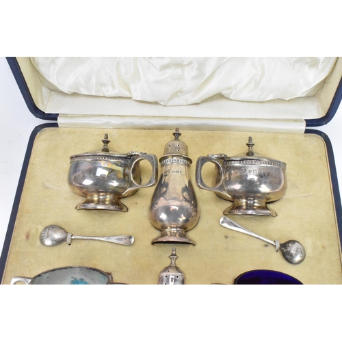 60 - A George V silver cased cruet set by Mappin & Webb, hallmarked Birmingham 1928, consisting of two mu... 