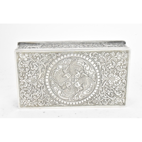 62 - An early/mid 20th century Indian silver cigarette box, the lid and side panels embossed with scenes ... 