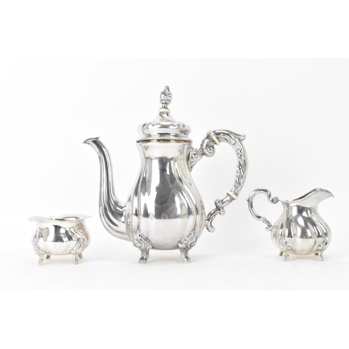 65 - An early 20th century sterling silver three piece coffee set, comprising of a coffee pot, cream jug,... 