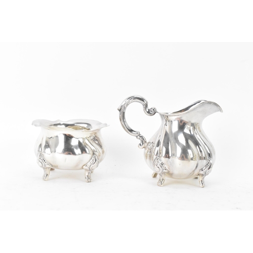 65 - An early 20th century sterling silver three piece coffee set, comprising of a coffee pot, cream jug,... 