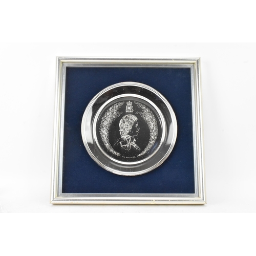 69 - An Elizabeth II silver limited edition royal commemorative silver salver, engraved with Queen Elizab... 