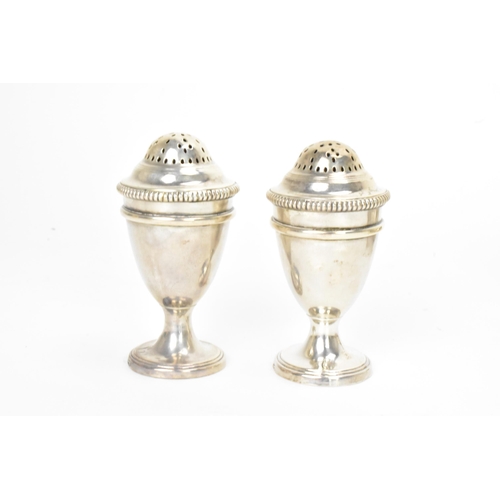 7 - A George III silver combination egg cruet set, makers marks possibly for Thomas Liddiard, hallmarked... 