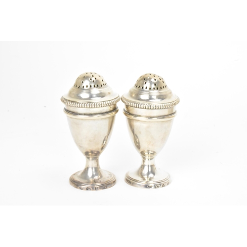 7 - A George III silver combination egg cruet set, makers marks possibly for Thomas Liddiard, hallmarked... 