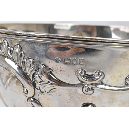 75 - An Edwardian silver bowl by William Hutton & Sons Ltd, hallmarked London 1906, embossed with flowers... 