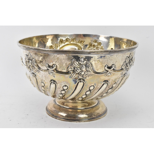 75 - An Edwardian silver bowl by William Hutton & Sons Ltd, hallmarked London 1906, embossed with flowers... 