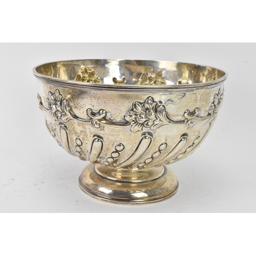 75 - An Edwardian silver bowl by William Hutton & Sons Ltd, hallmarked London 1906, embossed with flowers... 