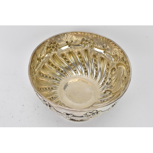 75 - An Edwardian silver bowl by William Hutton & Sons Ltd, hallmarked London 1906, embossed with flowers... 