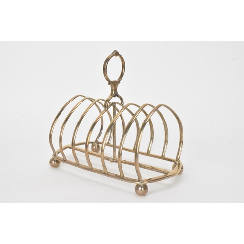 8 - A Victorian silver toast rack, makers marks possibly for Jane Brownett, hallmarked London 1880, with... 