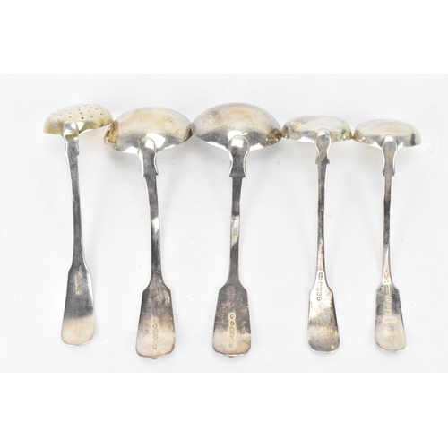 89 - Four 19th century silver sauce ladles and a sugar sifter spoon all in the fiddle and shell pattern, ... 