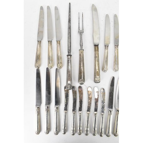 91 - A selection of 19th century and later silver handled cutlery to include a carving steel and knife by... 