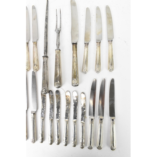 91 - A selection of 19th century and later silver handled cutlery to include a carving steel and knife by... 