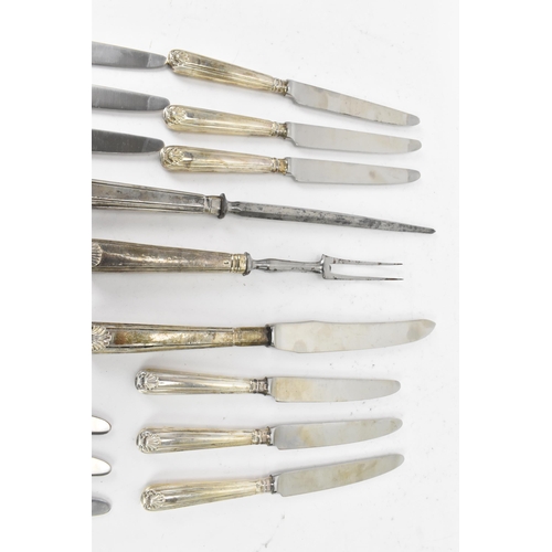 91 - A selection of 19th century and later silver handled cutlery to include a carving steel and knife by... 