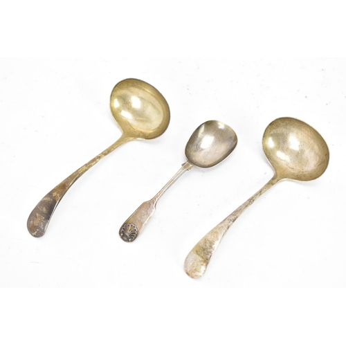 95 - An Edwardian pair of silver sauce ladles together with a Victorian small serving spoon, the ladles b... 