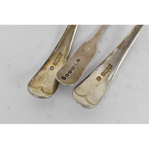 95 - An Edwardian pair of silver sauce ladles together with a Victorian small serving spoon, the ladles b... 