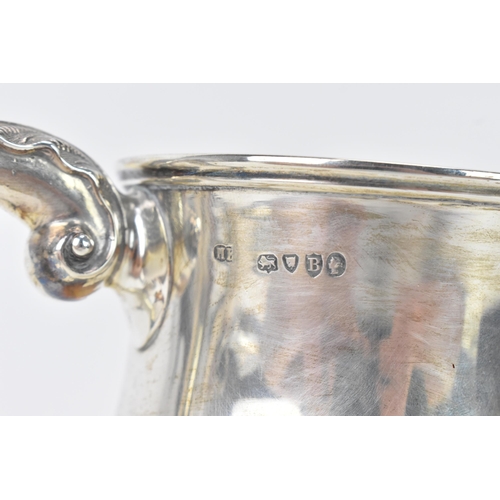 97 - A Victorian silver tankard hallmarked London 1877, makers marks rubbed, the body of baluster form an... 