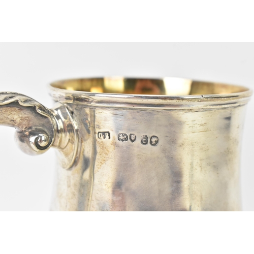 98 - A Victorian silver tankard hallmarked London 1861, makers marks rubbed, the body of baluster form an... 