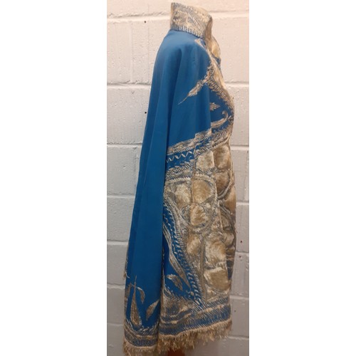 39 - A mid 19th Century Anglo-Indian embroidered cape having blue ground with intricate cream silk embroi... 