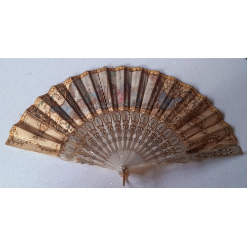 157 - A 19th Century mother of pearl wand and cream silk fan decorated with embroidery, sequins and images... 