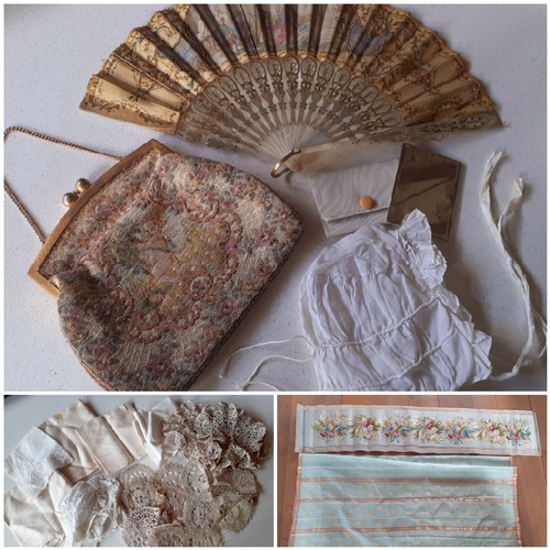 157 - A 19th Century mother of pearl wand and cream silk fan decorated with embroidery, sequins and images... 