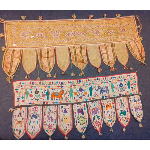 129 - A group of five 20th Century traditional Indian hand embroidered window valances, all measuring betw... 