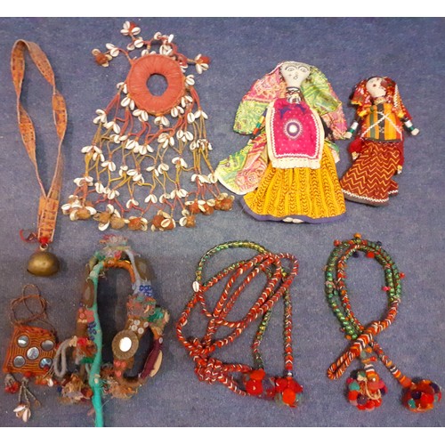 126 - A selection of traditional 20th Century Indian hand embroidered and hand sewn items to include a cow... 