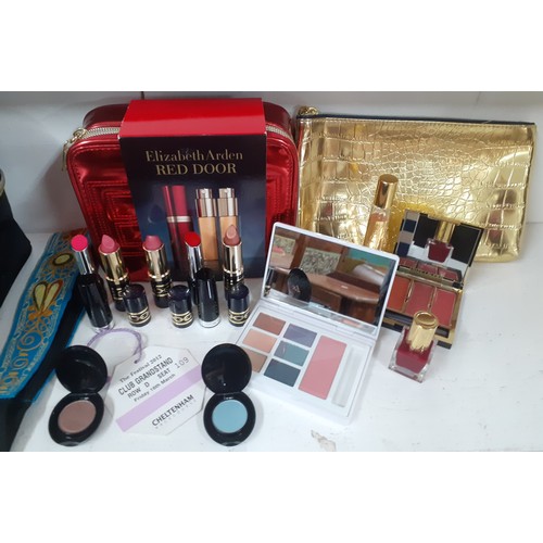 156 - An Estee Lauder cosmetic case with unused contents to include an Elizabeth Red Door purse vaporiser ... 