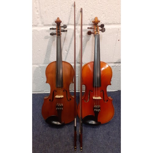 194 - Two student violins to include a Lark together with 2 hard cases and 2 bows. Location:RWF