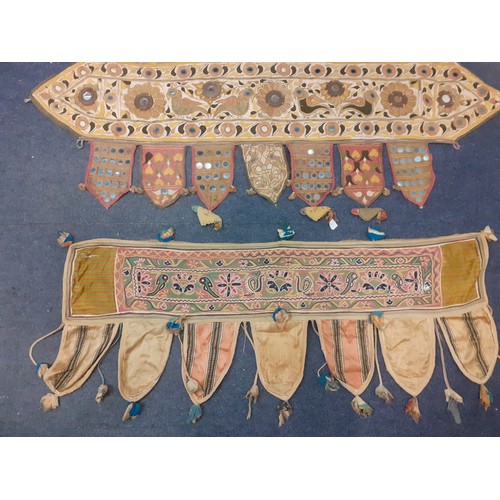 129 - A group of five 20th Century traditional Indian hand embroidered window valances, all measuring betw... 