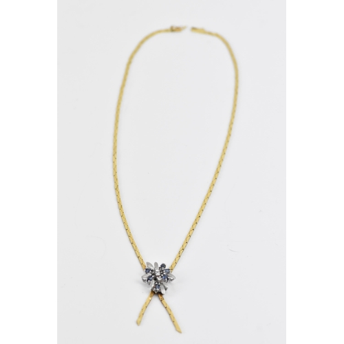 289 - An 18ct yellow and white gold sapphire and diamond necklace, the integral pendant in a floral design... 