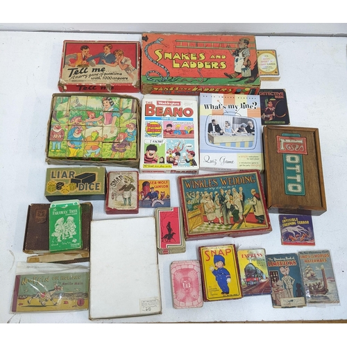 225 - A mixed lot to include vintage board games, puzzles, and playing cards, a 19th century French spelte... 