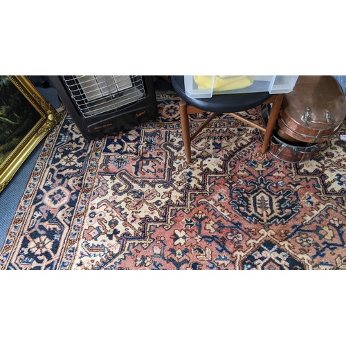 306 - A Persian handwoven rug having a central motif and geometric designs 333cm x 250cm Location:FOYER
If... 