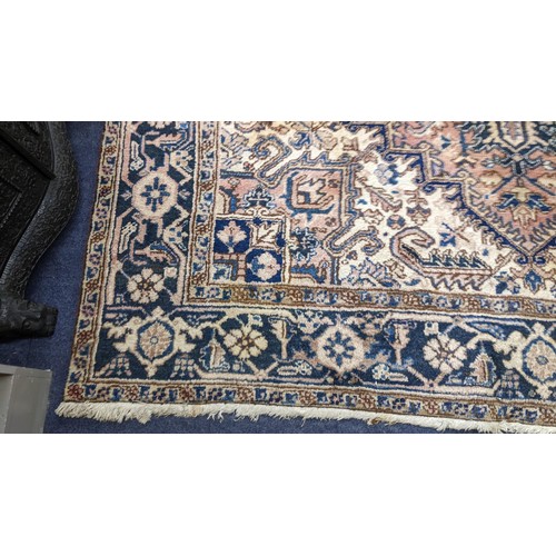 306 - A Persian handwoven rug having a central motif and geometric designs 333cm x 250cm Location:FOYER
If... 