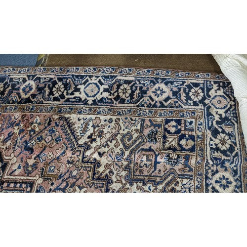 306 - A Persian handwoven rug having a central motif and geometric designs 333cm x 250cm Location:FOYER
If... 