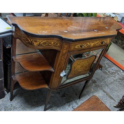 307 - A late Victorian walnut cabinet having marquetry inlaid open shelves, single drawer and a mirrored c... 