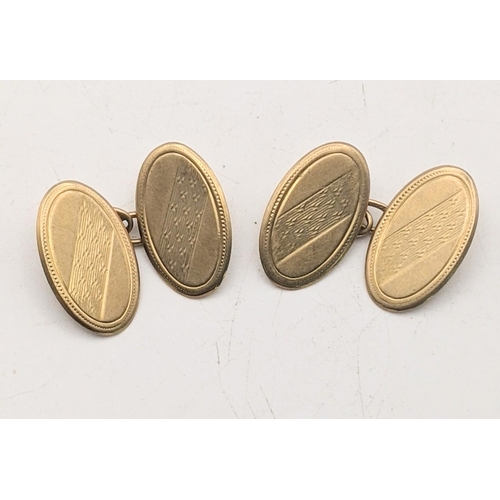 101 - A pair of 9ct gold oval shaped cufflinks with engine turned design 4.7g
Location: CAB2
If there is n... 